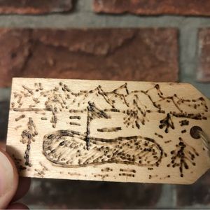 Golf bag tag. Wood burned.
